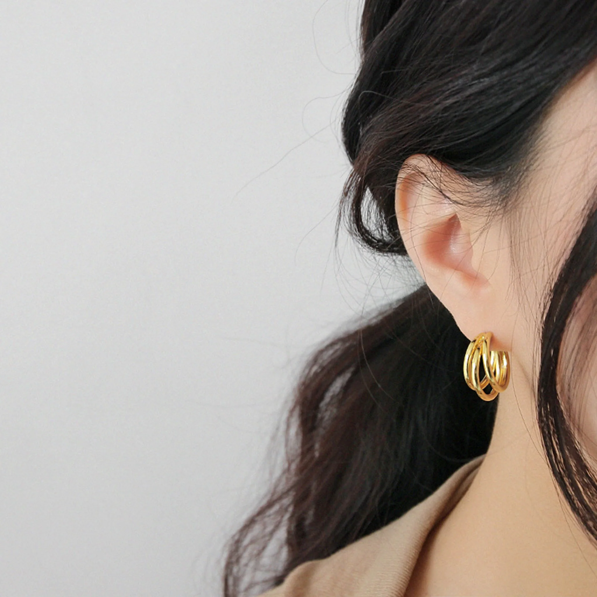 Multi-Layered Circular Gold Earrings - Image 3